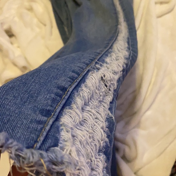 Blue jeans with rips down the side - Picture 3 of 4